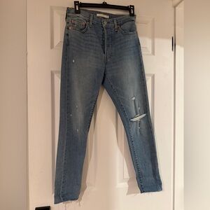 Women’s Levi’s button up jeans. Distressed.